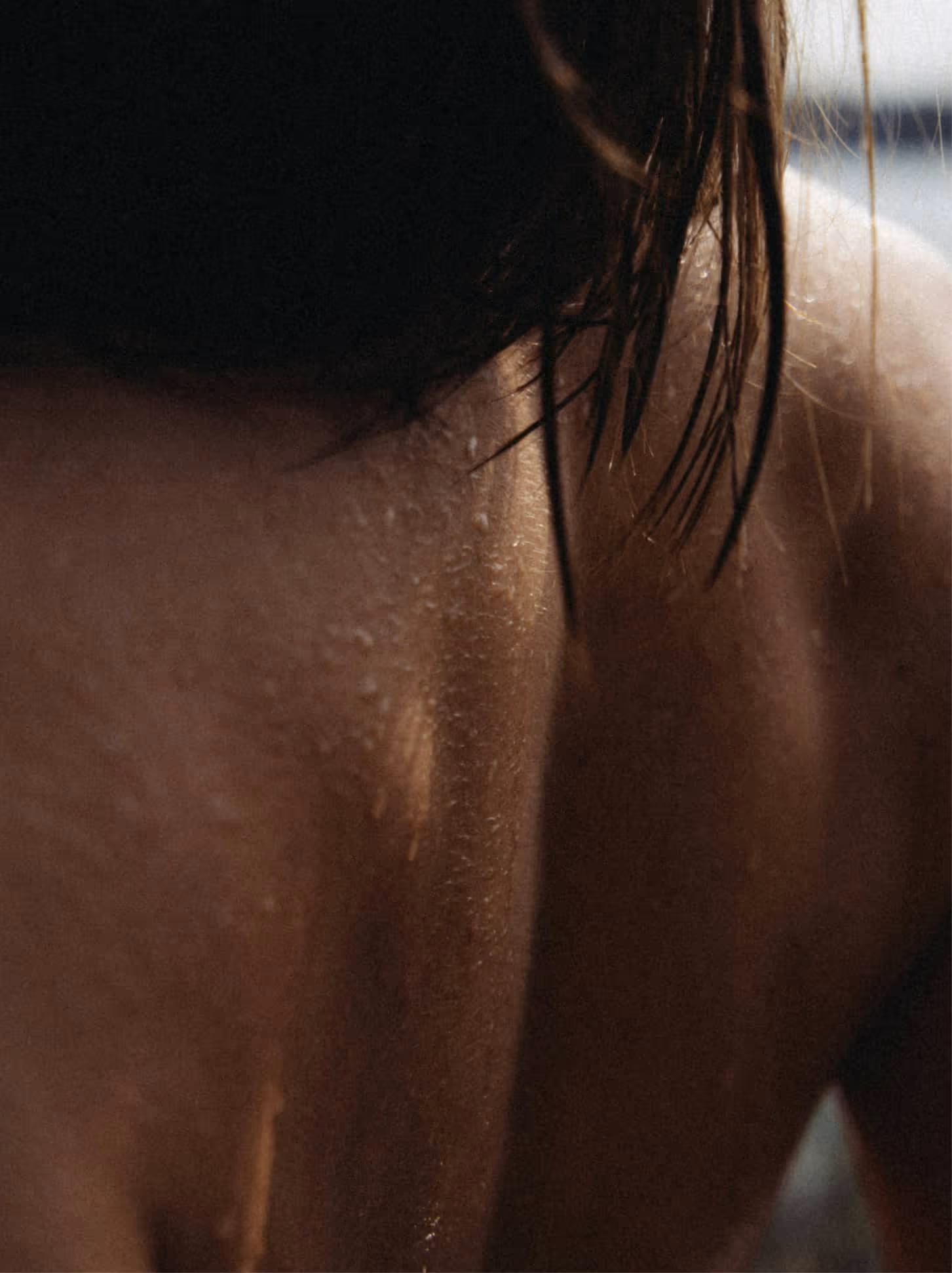 Close-up of the back of a woman with soft focus, hinting at personal change and evolving healthcare journeys.